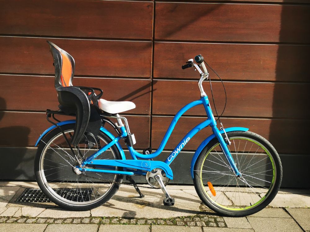 a bicycle parked on the side of a building