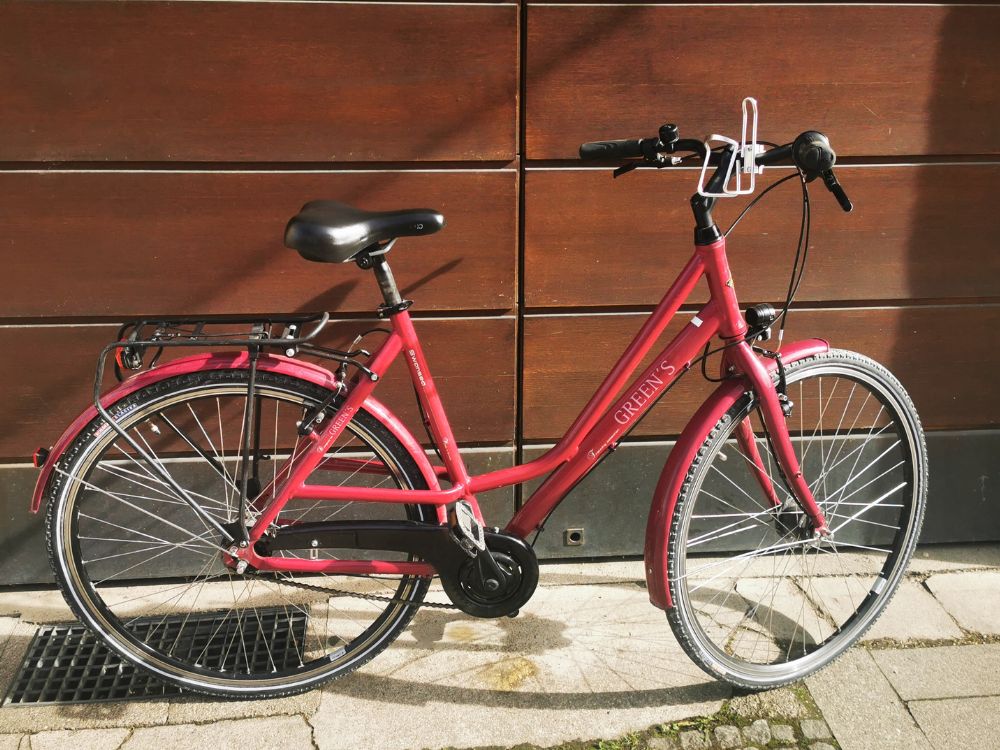 a bicycle parked on the side of a building