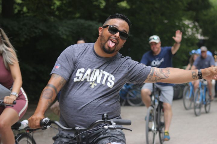 a man riding on the back of a bicycle