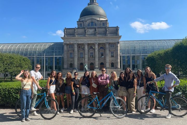 a group of people standing in front of a building