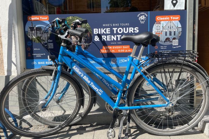 a bicycle parked on the side of a building