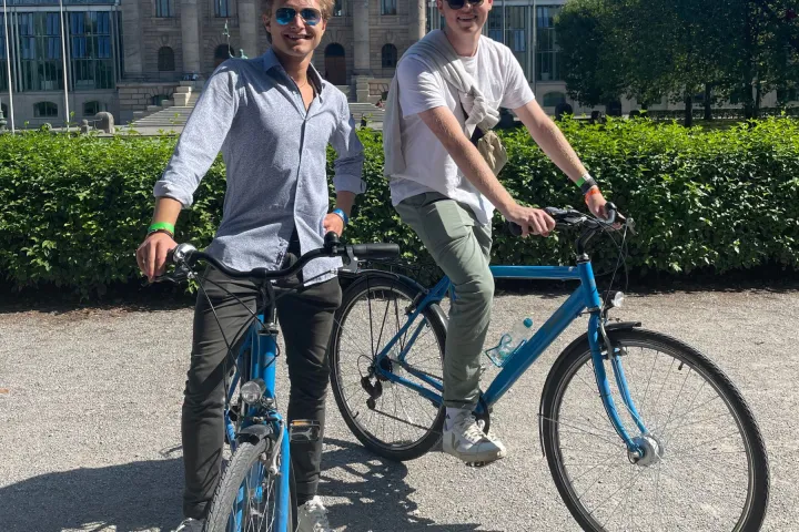 a man riding on the back of a bicycle