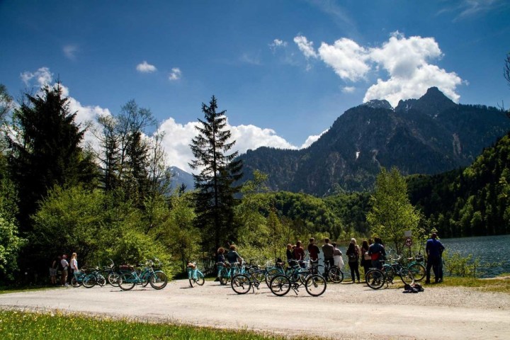 a row of parked motorcycles sitting on the side of a mountain