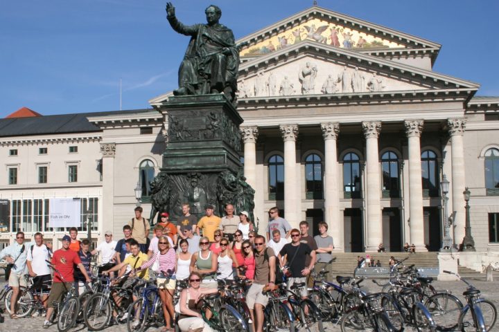 a group of people standing in front of a building