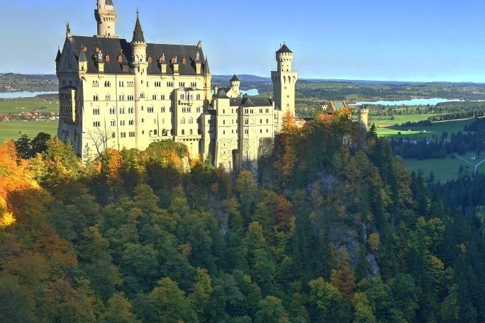 a castle with a clock on the tower of the city