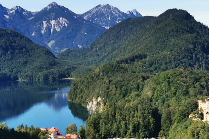 a large body of water with a mountain in the background