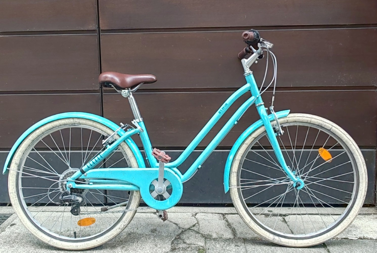 a bicycle parked on the side of a building