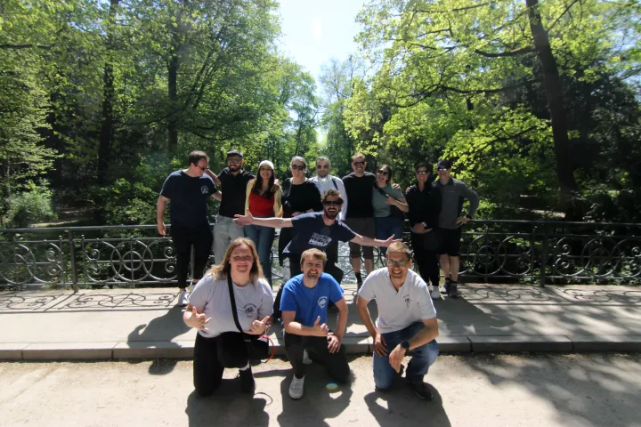 a group of people sitting on a skateboard