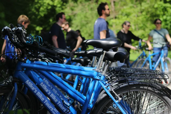 a bicycle is parked next to a blue motorcycle