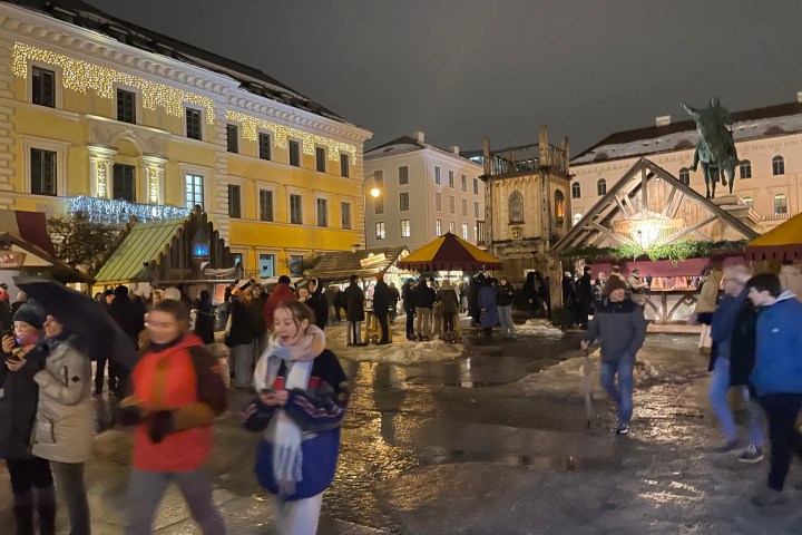 a group of people standing outside of a building