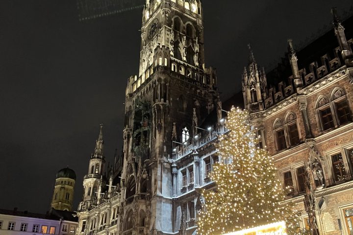 a large crowd of people standing in front of a building