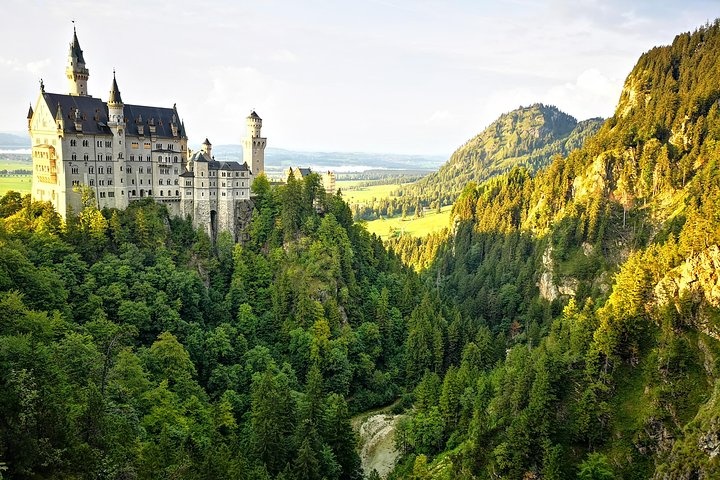a castle with a mountain in the background
