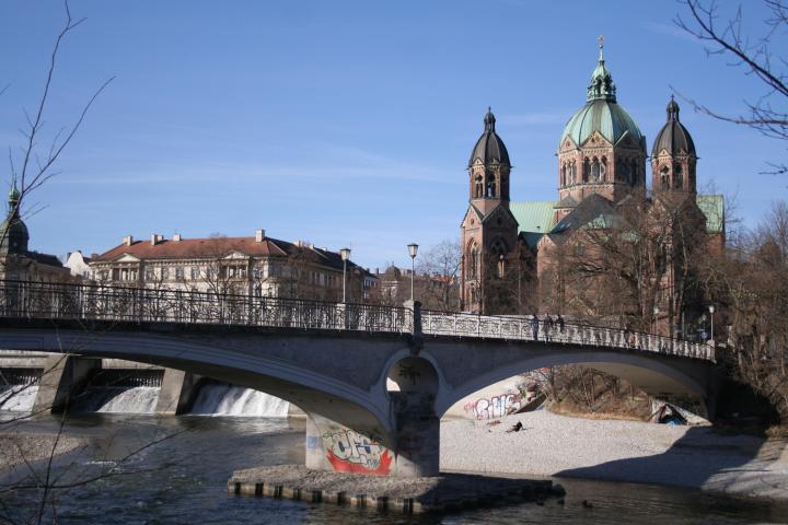 a large stone building near a bridge