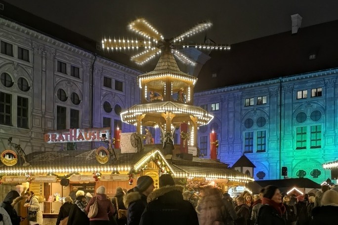 a group of people standing in front of a crowd
