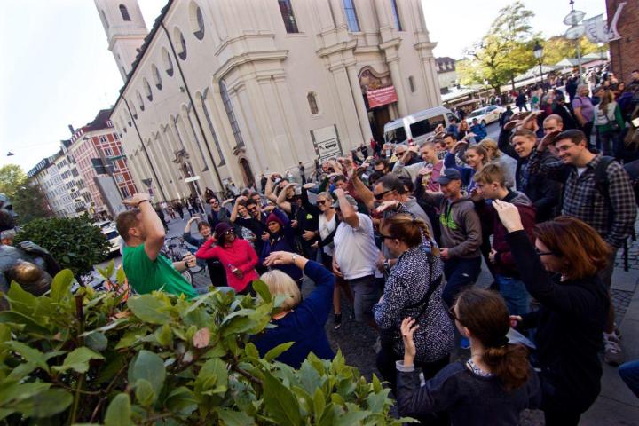 a group of people standing in front of a crowd