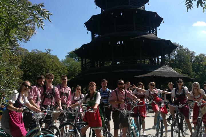a group of people standing in front of a crowd posing for the camera
