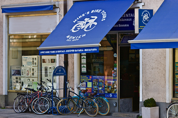 a bicycle parked in front of a store