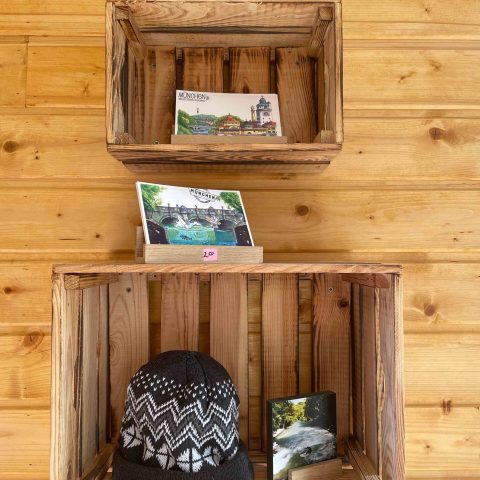a wooden shelf filled with items