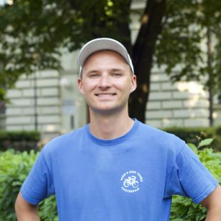 Greg a man in a blue shirt