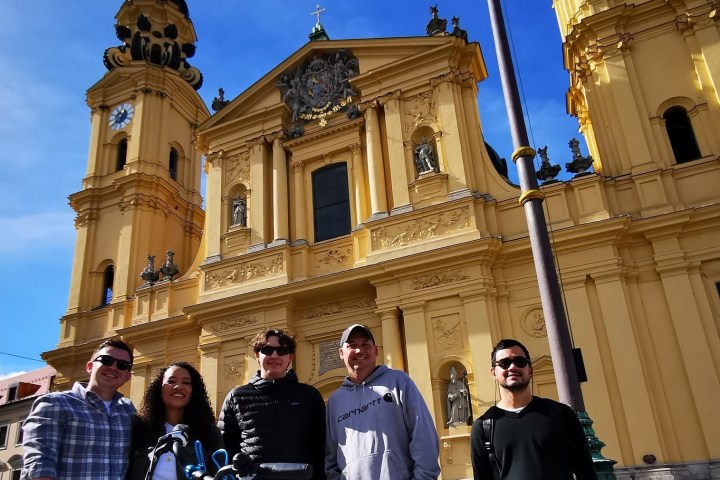 a group of people standing in front of a building