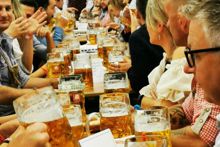 a group of people sitting at a table in a restaurant