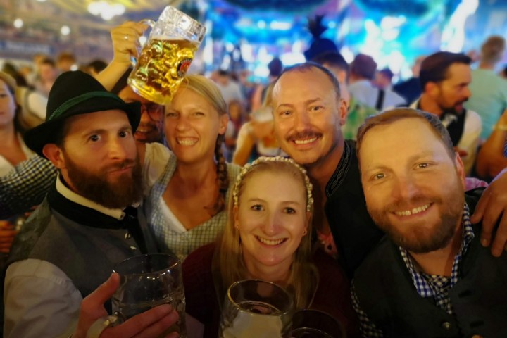 Paul Kalkbrenner et al. posing for a photo