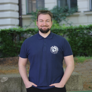 20 a man standing in front of a building